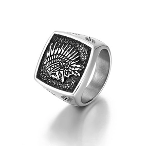 Detail view of a vintage stainless steel ring with Native American chief relief and arrows