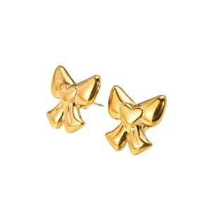 Minimalist 14K gold plated bow stud earrings with heart detail on white background