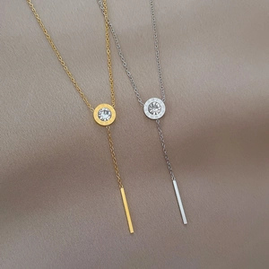 Roman numeral necklaces in gold and silver finish with tassel pendant and single crystal