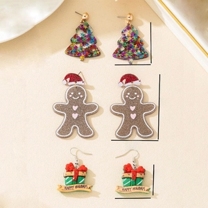 Three pairs of festive acrylic Christmas earrings featuring gingerbread man and tree