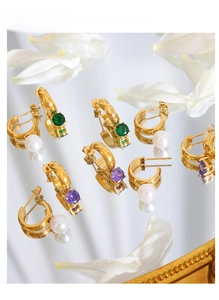 Polished gold semi-circle earrings featuring green, purple gems and white pearls