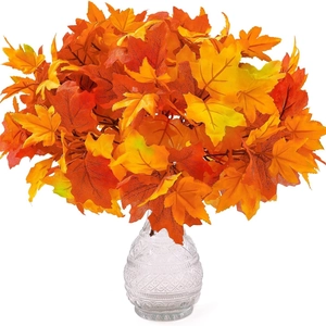 Artificial autumn maple leaf branches in a textured glass vase for home kitchen decor