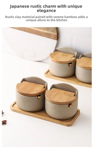 Macro view of Japanese ceramic spice jars with bamboo lids and trays in minimalist style