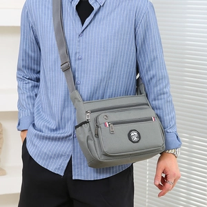 Gray multi-compartment crossbody bag for men in durable nylon for daily business use