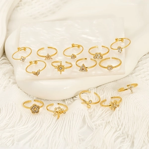 Gold stainless steel geometric ring set with sparkling white zircon and diverse motifs