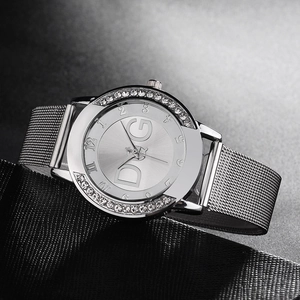 Silver women's watch with crystal-set bezel and Milanese mesh strap on black texture