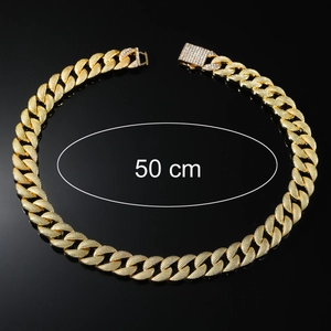 Macro shot of 16mm gold Cuban link chain with 50cm length and diamond buckle detail