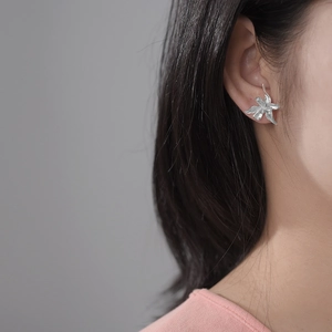 Artistic S925 sterling silver iris flower stud earrings with brushed metal texture