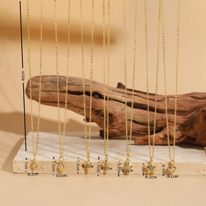 Gold plated necklaces with diverse pendants like stars and hearts, 40cm chain length