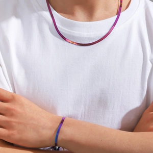Rainbow plated titanium steel snake chain necklace and bracelet set on model