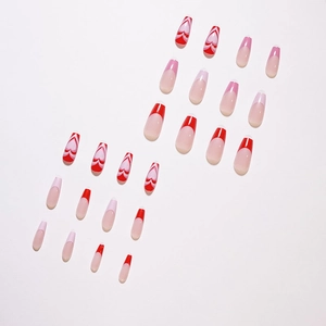 French tip press-on nails set with red and pink heart patterns in long trapezoid shape