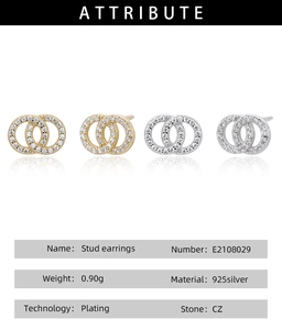 Detail view of double circle twisted stud earrings in silver and gold with CZ stones