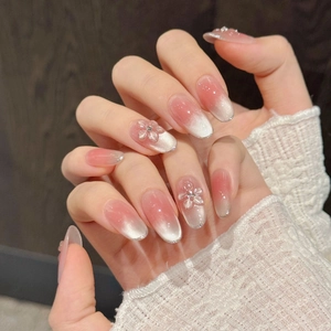 Pink gradient cat-eye press-on nails with 3D flower charms and silver glitter edges