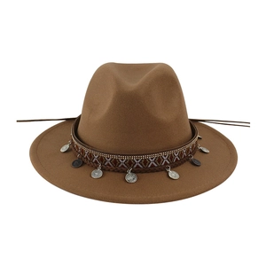 Close-up of a brown wool felt fedora hat with ethnic band and silver coin charms