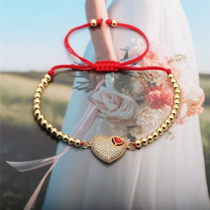 Red braided rope bracelet with 4mm gold beads and crystal heart pendant for women