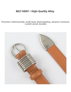Macro shot of a caramel leather belt featuring a unique silver knotted alloy buckle detail