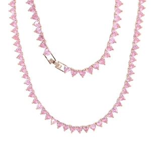 Macro detail of 5mm tennis chain with pink heart-shaped stones and rose gold finish