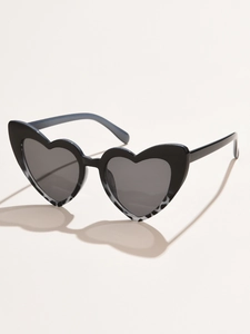 Detailed side view of heart-shaped sunglasses with black frames and grey marble accents