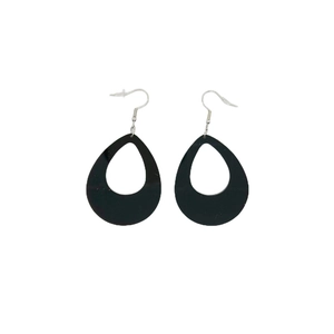 Detail of minimalist black teardrop cutout earrings with silver hooks on white background