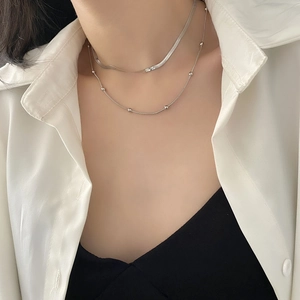 Minimalist silver double-layer titanium necklace with flat snake chain and bead detail