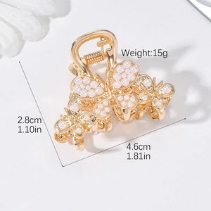 Detail view of pearl butterfly hair claw with dimensions 4.6cm width and 15g weight