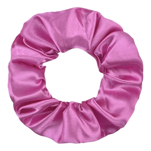 Close-up of vibrant magenta satin scrunchie with smooth silk texture and soft ruffles