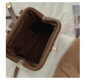 Overhead view of contrast retro crossbody bag showing spacious interior and premium leather