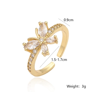 Macro detail of gold butterfly ring with zircons showing dimensions and 0.9cm width
