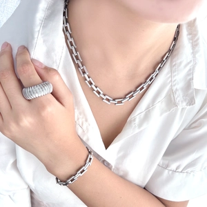 Silver stainless steel jewelry set featuring a chunky square link necklace and bracelet