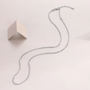 Detail shot of the polished 925 sterling silver chain link necklace on a soft background