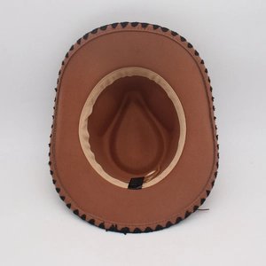Interior view of brown wide brim fedora showing the beige sweatband and care label