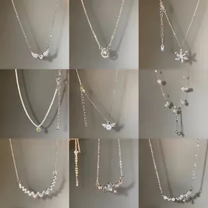 Collection of nine luxury titanium steel necklaces with pearls and zirconia pendants
