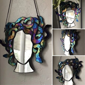 Medusa stained glass suncatcher with iridescent snake hair and a central mirror wall hanging