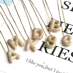 Initial letter necklaces in 18K gold plating with sparkling cubic zirconia pavé setting