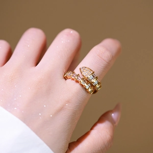 Adjustable gold plated snake ring featuring sparkling baguette and round zircon stones