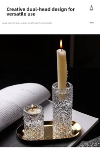 Close-up of dual-use geometric glass candle holders on a luxury gold metal tray decor