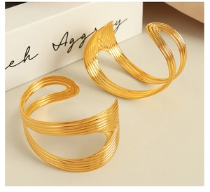Detail of hollow multi-layer parallel lines on 18K gold plated vintage cuff bracelet