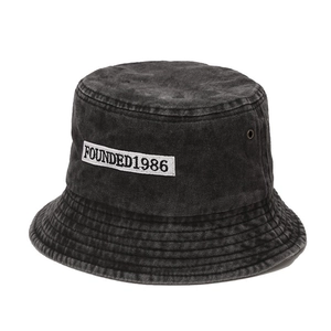 Retro washed dark grey cotton bucket hat with white FOUNDED 1986 embroidery patch