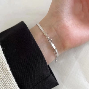 Elegant S925 sterling silver snake bone bracelet on wrist with lobster clasp closure