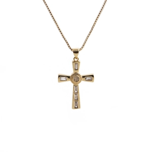 Minimalist gold cross pendant necklace with sparkling white zircons on a white background