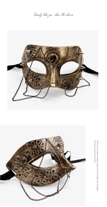 Detail of vintage steampunk mask with bronze finish, metallic spikes and hanging chains
