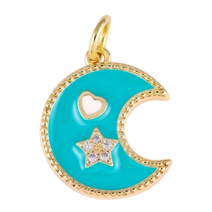 Macro view of gold moon pendant with turquoise enamel, white heart and zircon star
