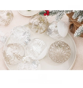 Detail of transparent 8cm Christmas balls with gold glitter snowflakes and pine needle decor