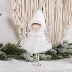 White Christmas angel ornament with silver wings and bells on a snowy pine branch