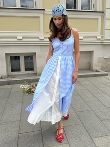 Blue plaid summer dress featuring layered white button skirt and elegant crochet hat