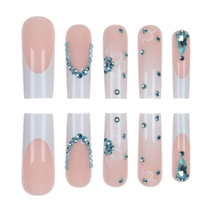 Long coffin press-on nails with blue rhinestones, white flowers and French tip design