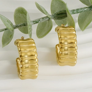 U-shaped textured chunky gold hoop earrings with wave pattern in stainless steel