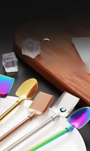 Detailed view of square and pointed 304 stainless steel straw spoons in four colors