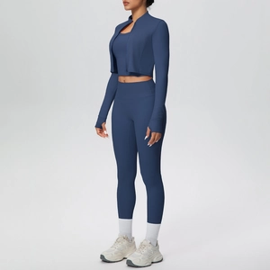 Detail of high-stretch navy blue 3-piece yoga set including zip jacket and leggings