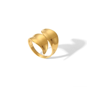 Macro shot of the polished golden curved ring with unique leaf-shaped open design